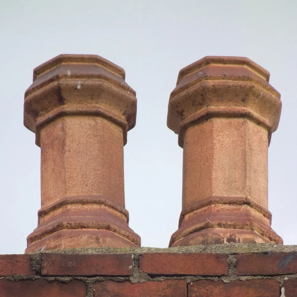 Terracotta chimney pots on a brick chimney
