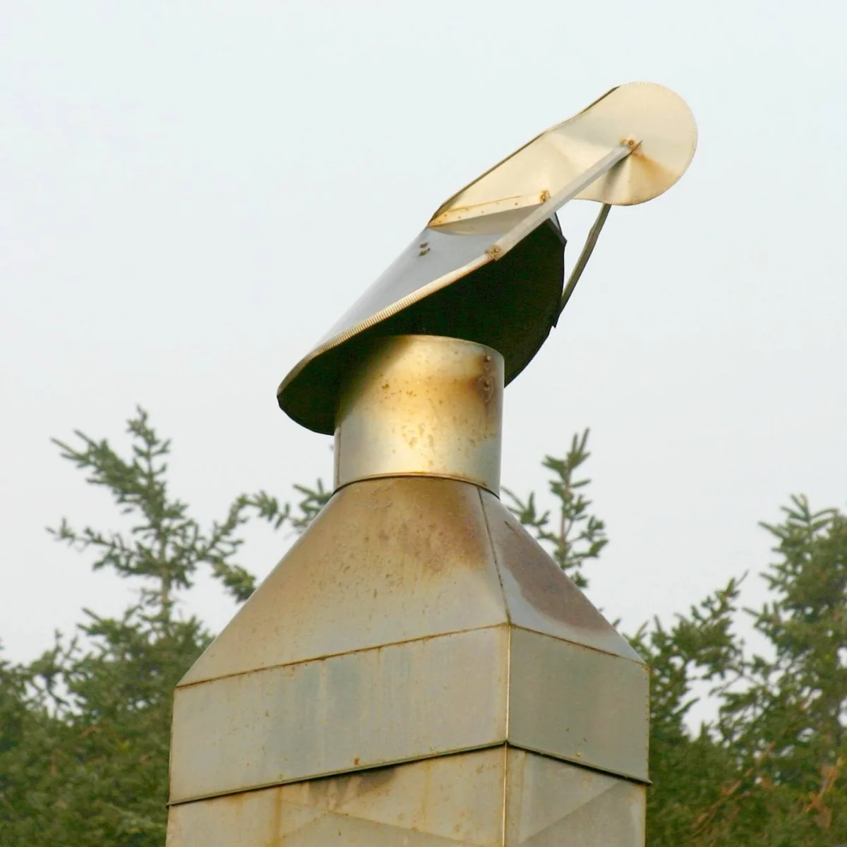 Directional metal chimney cap