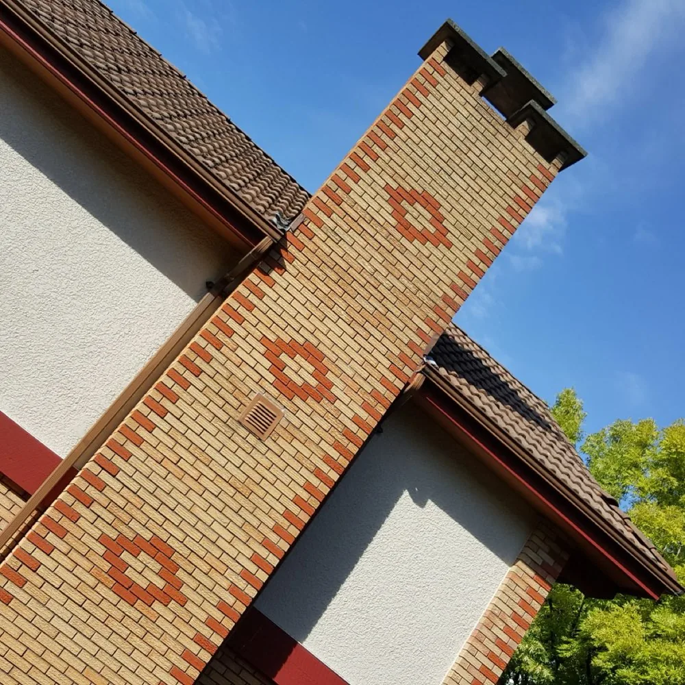Decorative brick chimney on a stucco home